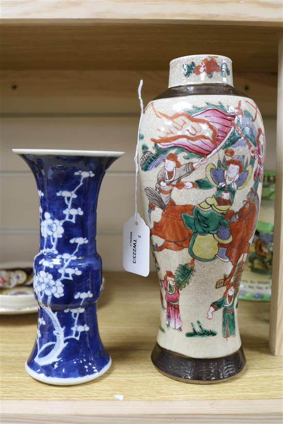 A Chinese blue and white Gu vase, decorated with prunus blossom and a crackleware vase, H 20cm & 29cm